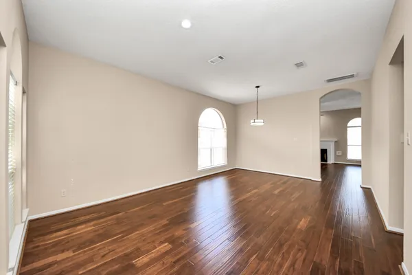a kitchen with a sink cabinets stainless steel appliances and a window