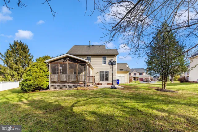 a sign that is sitting in front of flowers