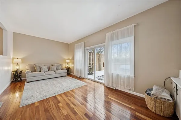 a bedroom with furniture and a flat screen tv