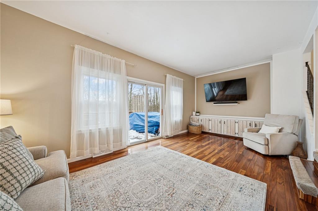 206 Falls Village Road Pittsburgh, PA 15239 - Photo 12 of 38 a bedroom with furniture and a flat screen tv