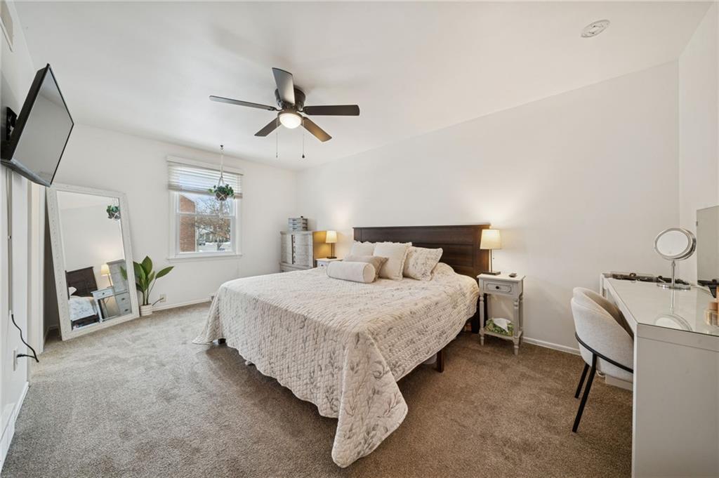 206 Falls Village Road Pittsburgh, PA 15239 - Photo 14 of 38 a bed room with a bed and a chair