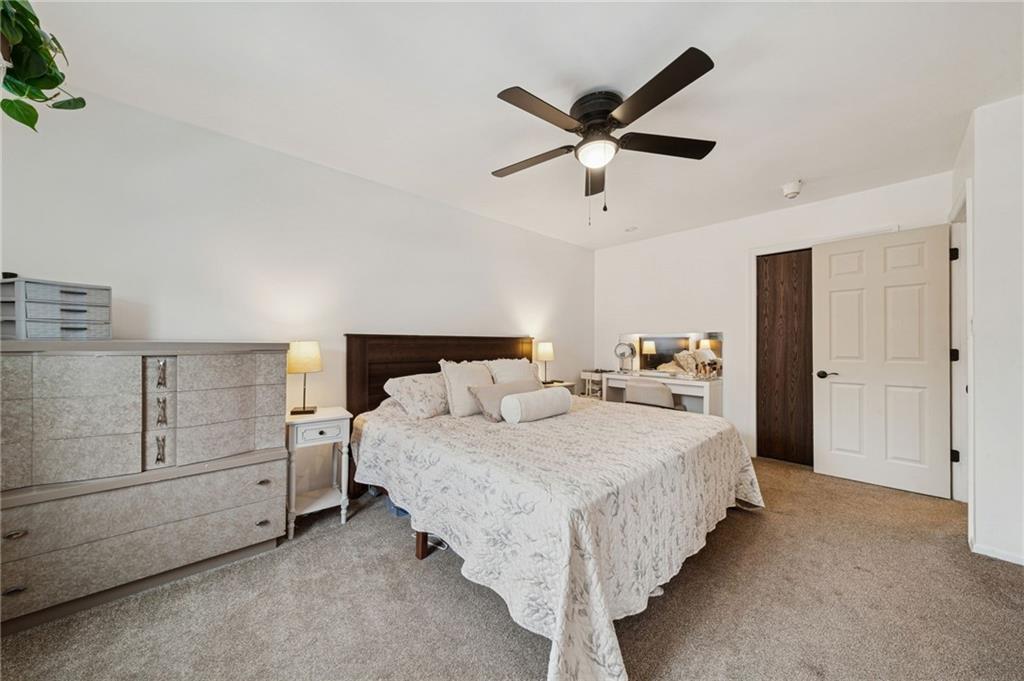 206 Falls Village Road Pittsburgh, PA 15239 - Photo 16 of 38 a bedroom with a bed and cabinet