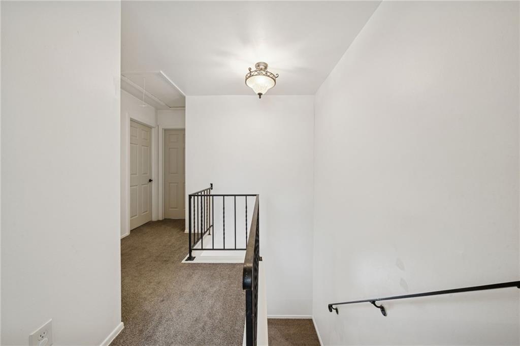 206 Falls Village Road Pittsburgh, PA 15239 - Photo 19 of 38 a view of a livingroom with wooden floor and a ceiling fan