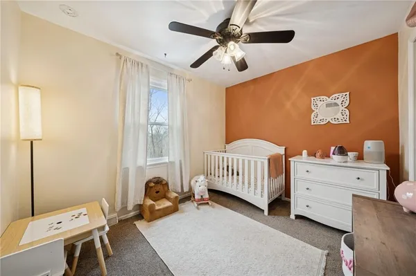 a bedroom with furniture and a window