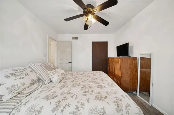a bedroom with furniture and a fireplace