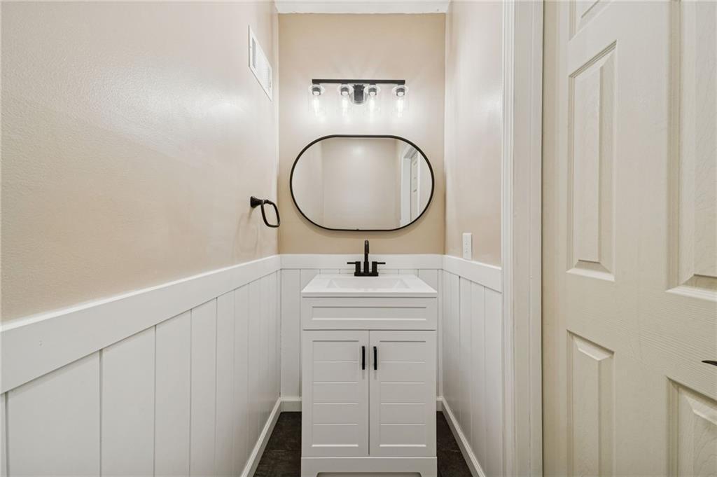 206 Falls Village Road Pittsburgh, PA 15239 - Photo 30 of 38 a bathroom with a sink and a mirror