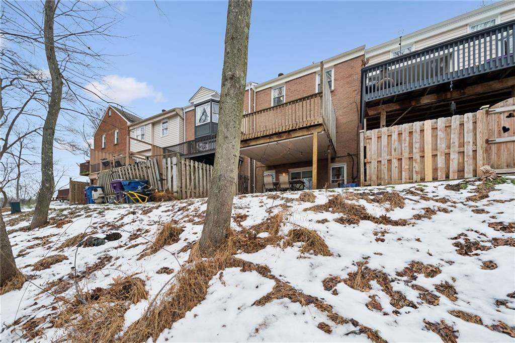 206 Falls Village Road Pittsburgh, PA 15239 - Photo 34 of 38 a view of a house with a yard covered in snow