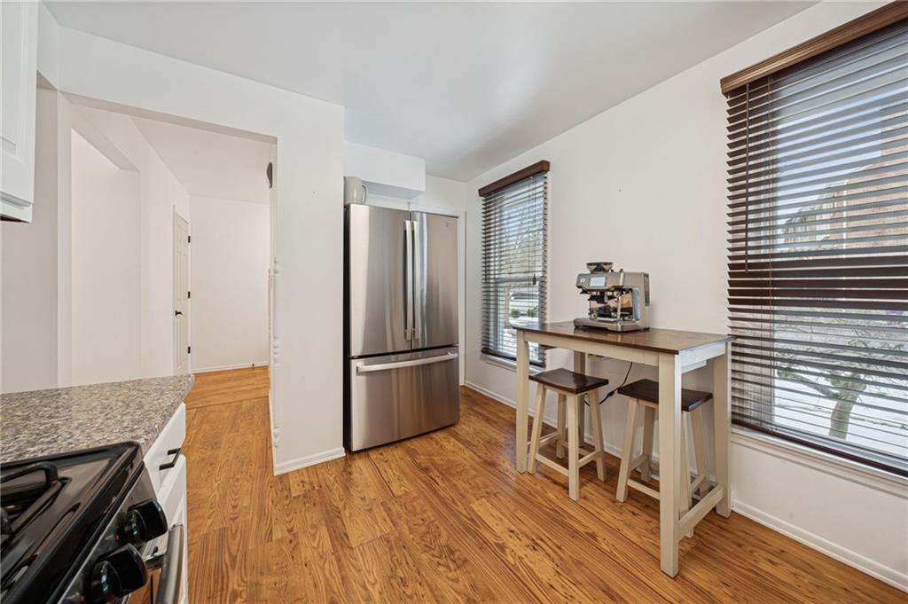 206 Falls Village Road Pittsburgh, PA 15239 - Photo 7 of 38 a kitchen with dining table and chairs