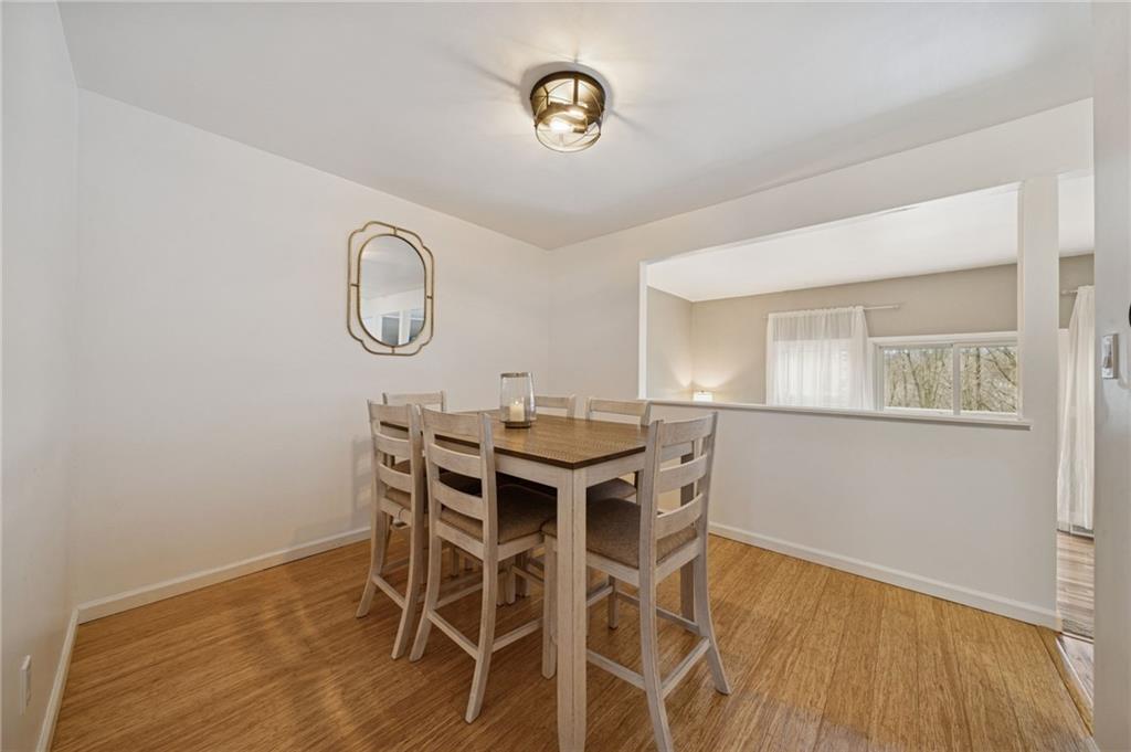 206 Falls Village Road Pittsburgh, PA 15239 - Photo 9 of 38 a view of a dining room with furniture and wooden floor