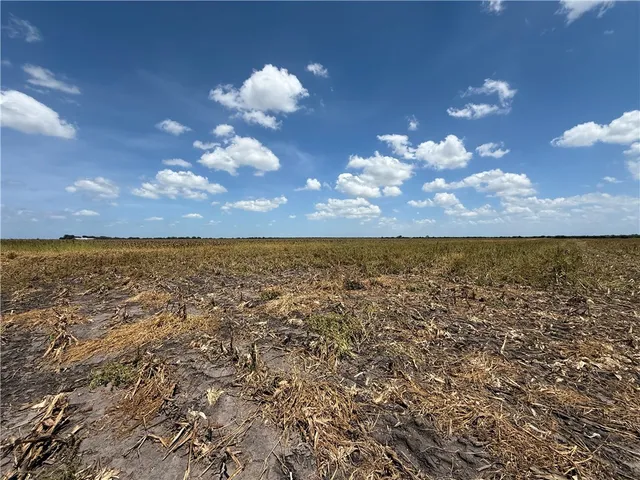 an aerial view of houses with yard