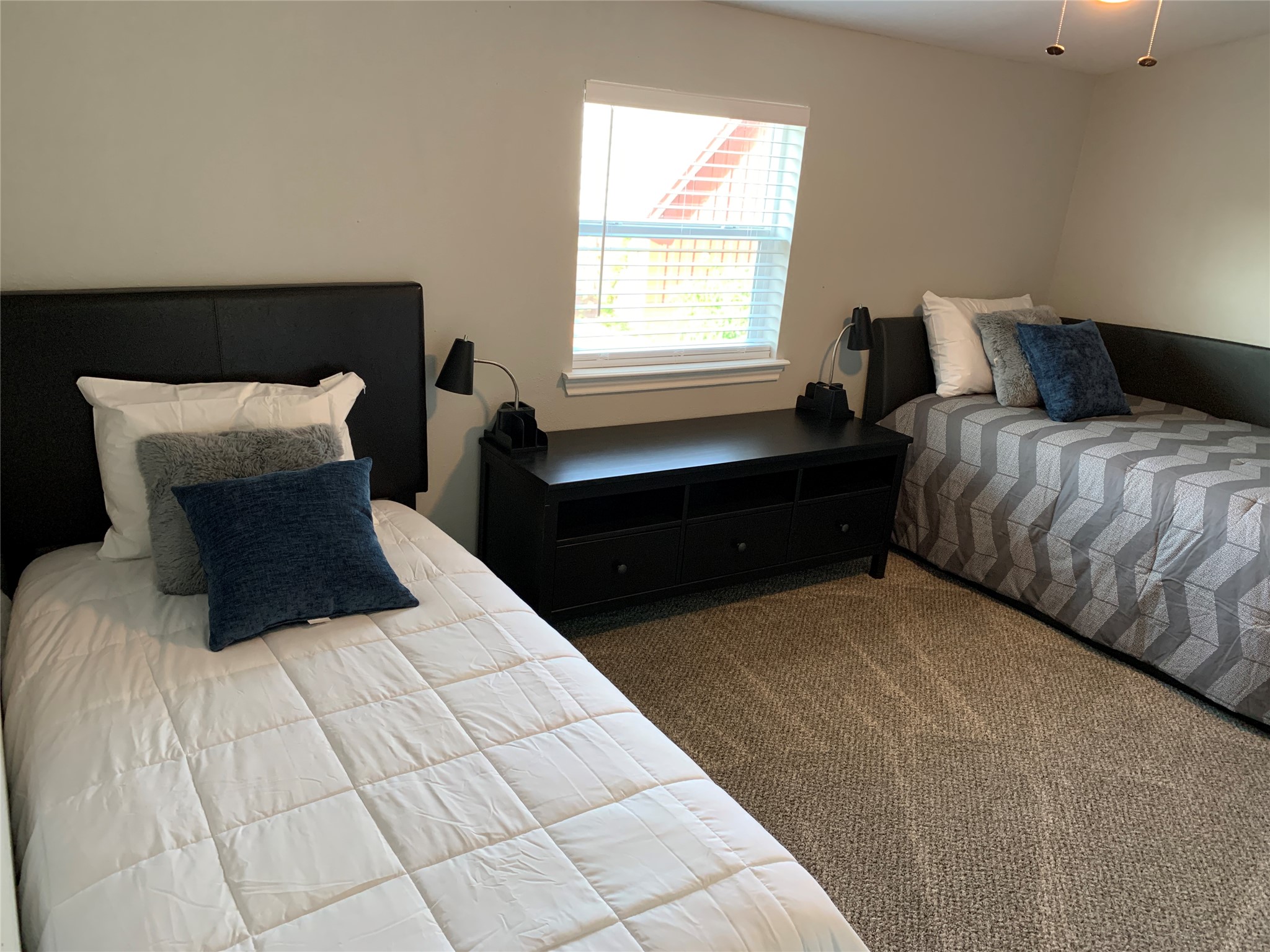 1909 Ruth Street Houston, TX 77004 - Photo 14 of 35 a bedroom with a bed and window