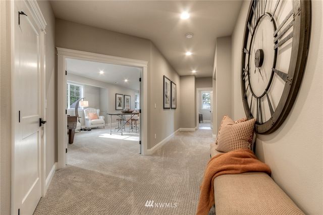 a view of hallway with livingroom and furniture
