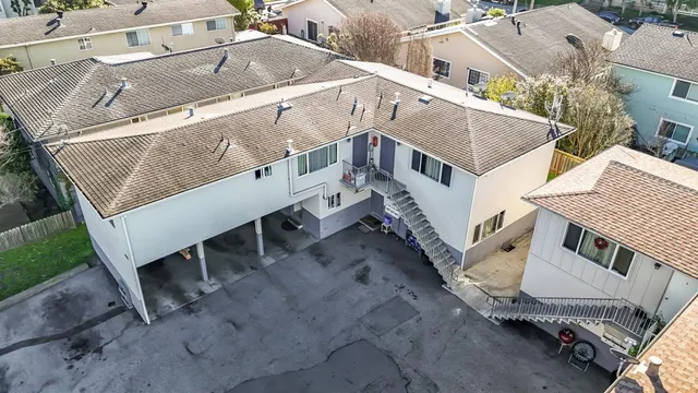 a aerial view of a house with a yard