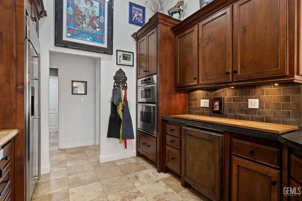 a spacious bathroom with a sink double vanity granite tub and shower