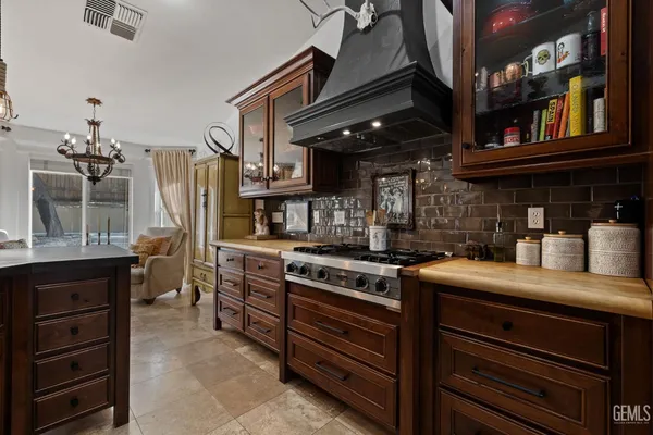 a living room with furniture a flat screen tv and a window