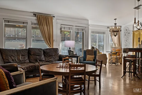 a view of a house with a tree in front of it