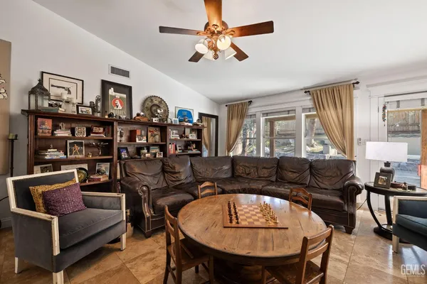 an aerial view of a house with a yard and garden