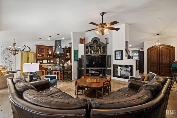 a view of a house with a yard and potted plants