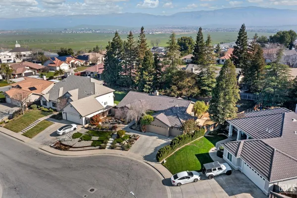 an aerial view of a house with outdoor space