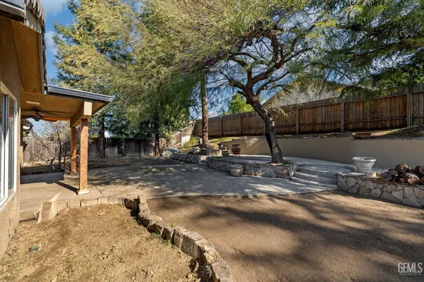 a bedroom with two bed and a window