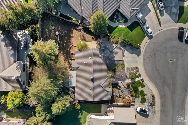 a bathroom with a double vanity sink toilet and shower