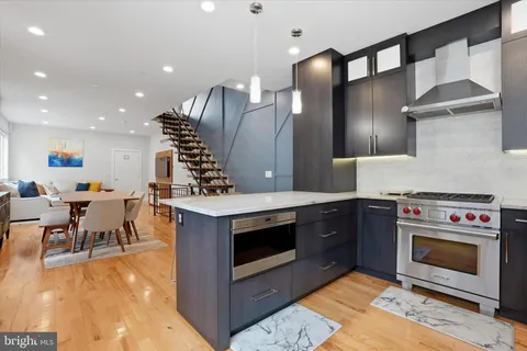 a kitchen with a stove and a fireplace
