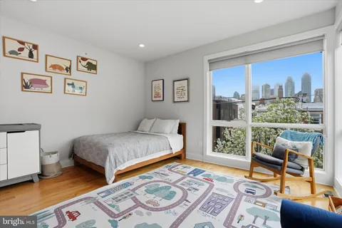 a bedroom with bed and a window