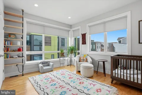 a living room with furniture and a rug