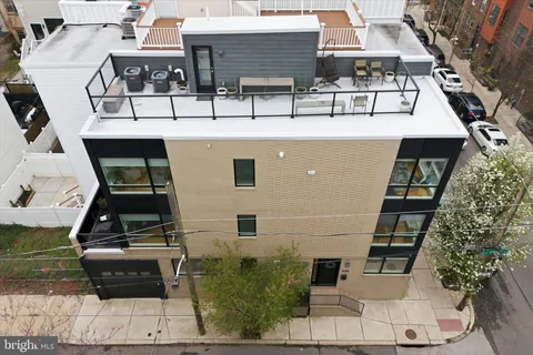 an aerial view of a house with large windows