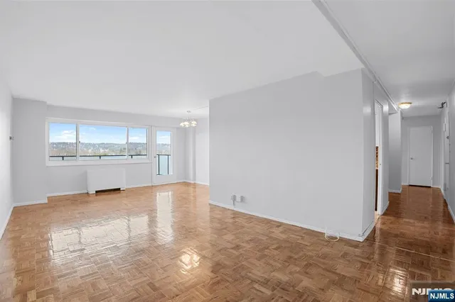 a view of a kitchen with a sink and cabinets