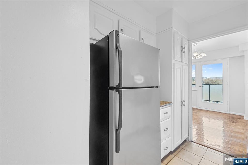 377 South Harrison Street, Unit 9G East Orange, NJ 07018 - Photo 6 of 27 a bathroom with a shower and a mirror