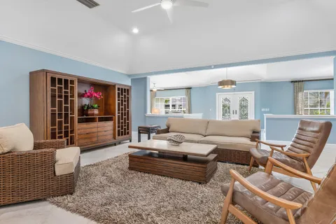 a kitchen with a sink window and cabinets