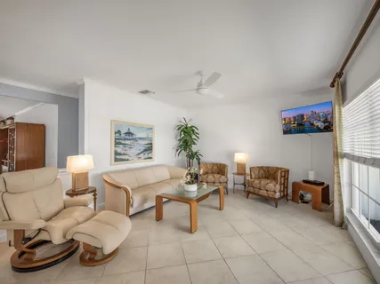 a work room with furniture and a flat screen tv