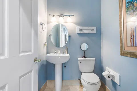 a bathroom with a bathtub sink and shower