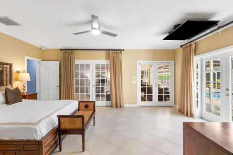 a bathroom with a tub sink shower and mirror