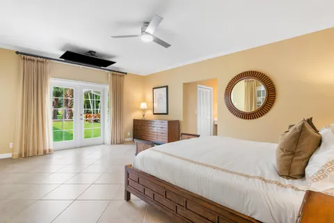 a view of a patio with couches chairs and a potted plant