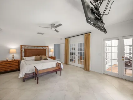 a view of a backyard with a patio and swimming pool