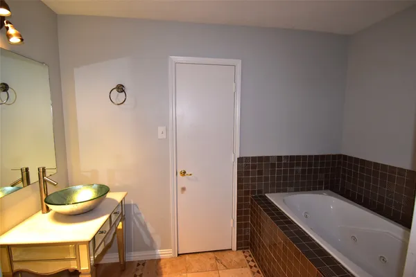 a bathroom with a bathtub and a sink