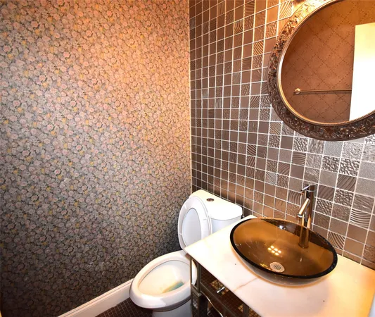 a bathroom with a toilet and a sink