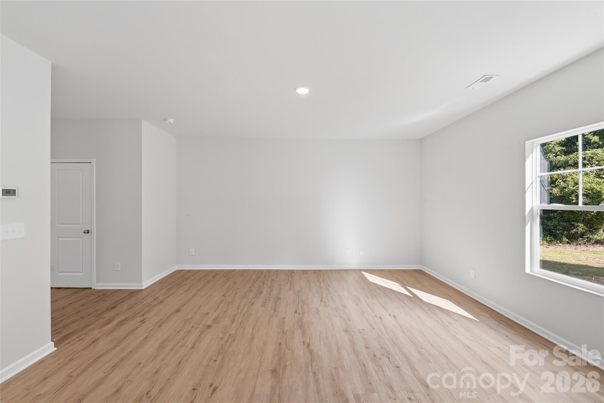 242 Landers Chapel Road Lincolnton, NC 28092 - Photo 13 of 33 a view of room with window and wooden floor