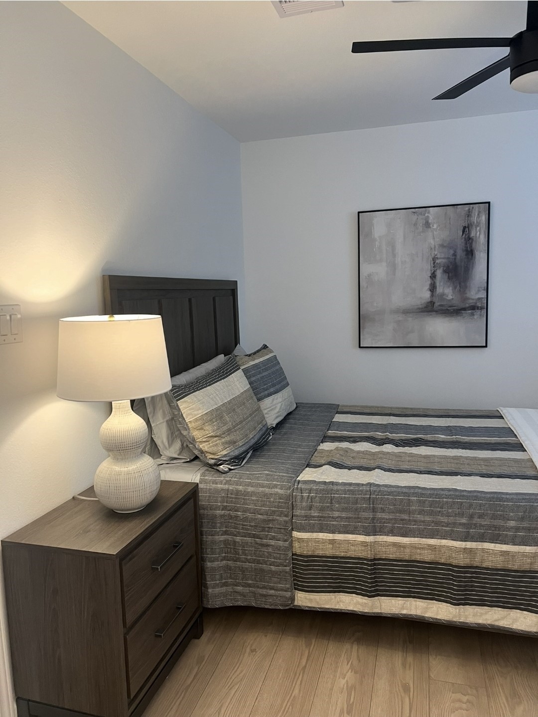 620 St Lawrence River Road Conroe, TX 77316 - Photo 13 of 21 a bedroom with a bed and a lamp on the dresser