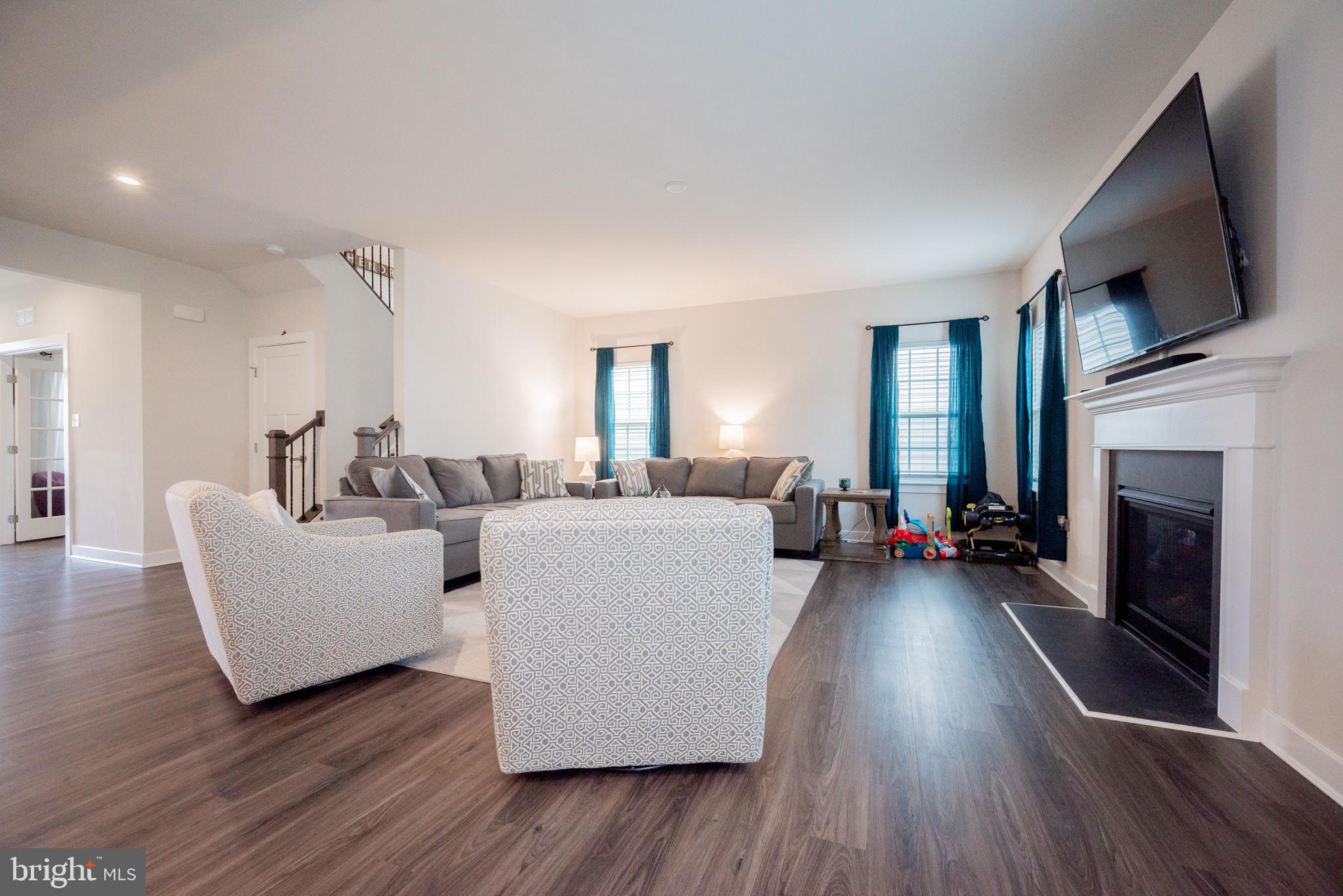 772 Wallasey Drive Middletown, DE 19709 - Photo 11 of 60 a living room with furniture fireplace and flat screen tv