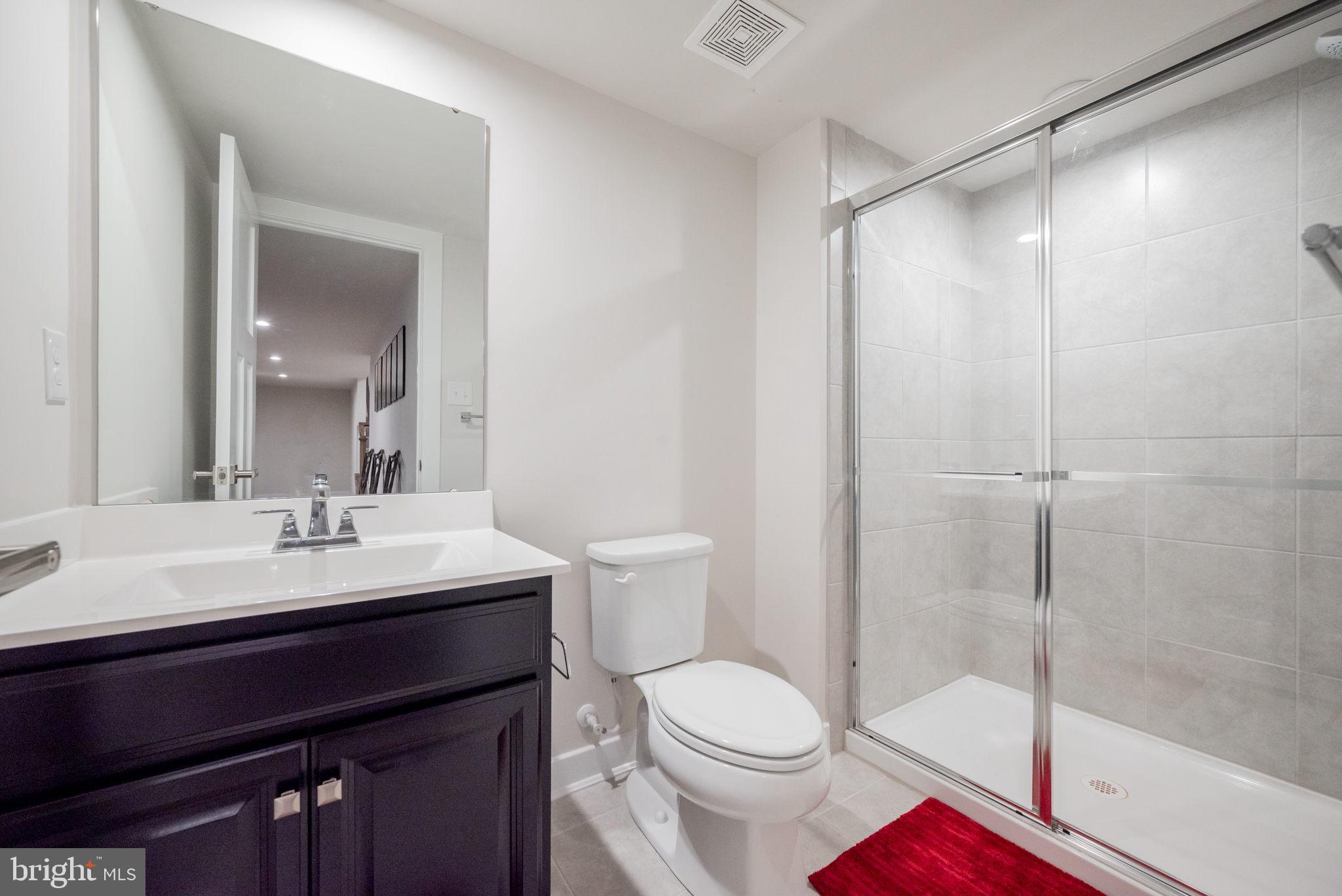 772 Wallasey Drive Middletown, DE 19709 - Photo 12 of 60 a bathroom with a sink a toilet and shower