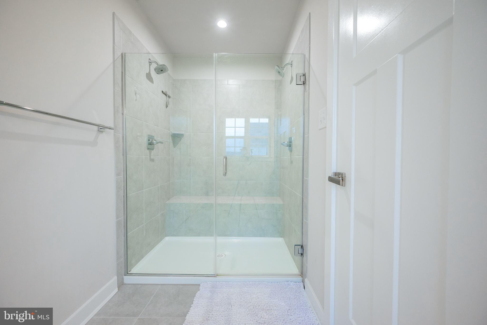 772 Wallasey Drive Middletown, DE 19709 - Photo 15 of 60 a bathroom with a shower and a glass door