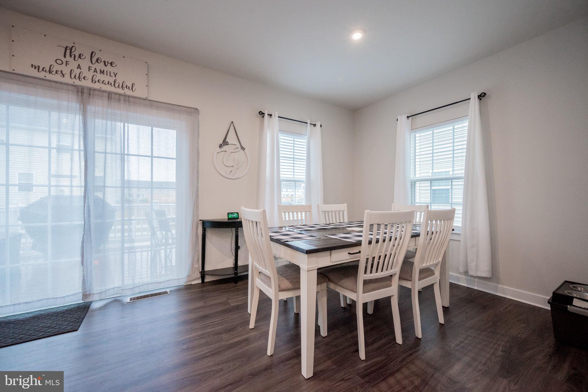 772 Wallasey Drive Middletown, DE 19709 - Photo 23 of 60 a view of a dining room with furniture and wooden floor