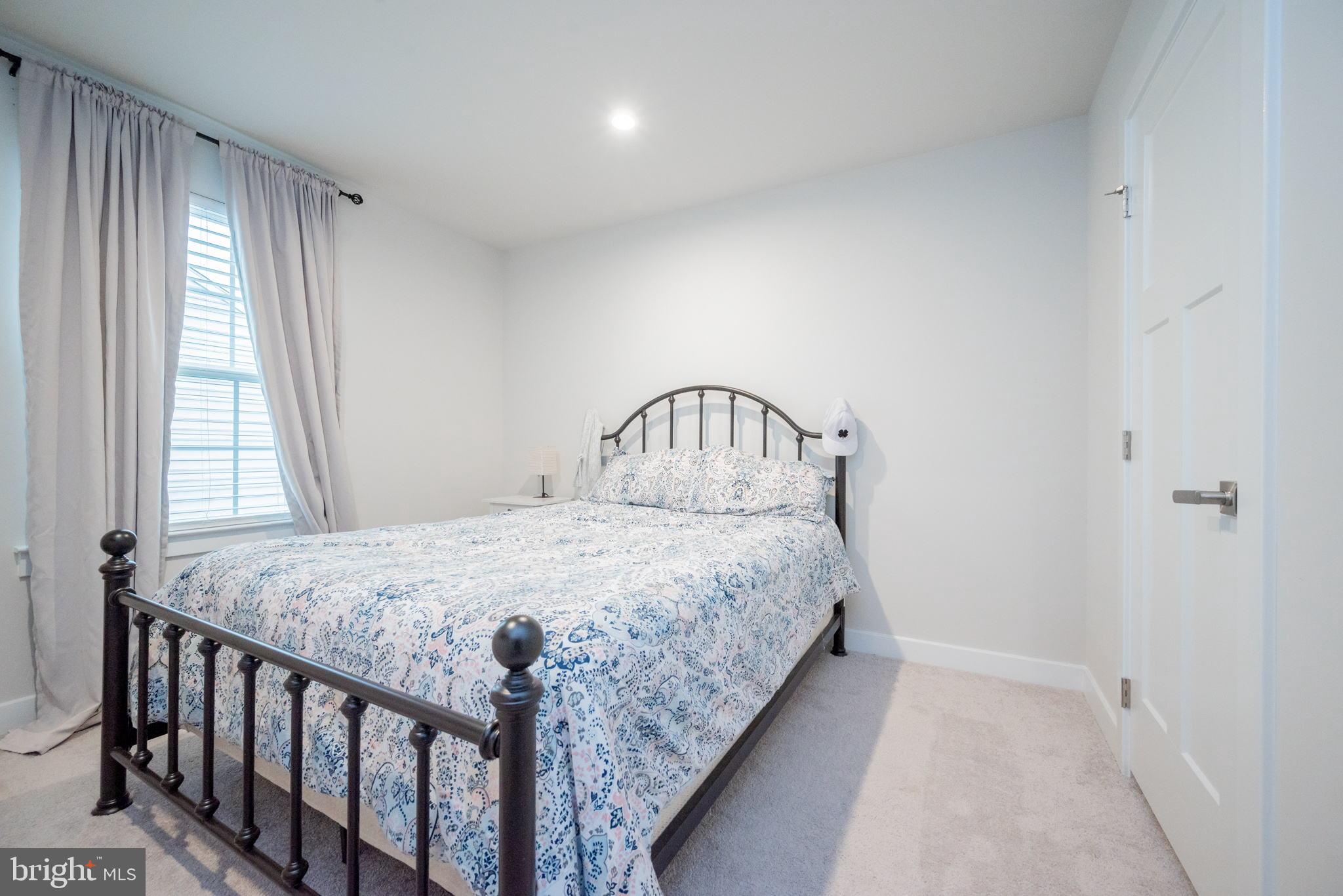 772 Wallasey Drive Middletown, DE 19709 - Photo 32 of 60 a bedroom with a bed next to a window