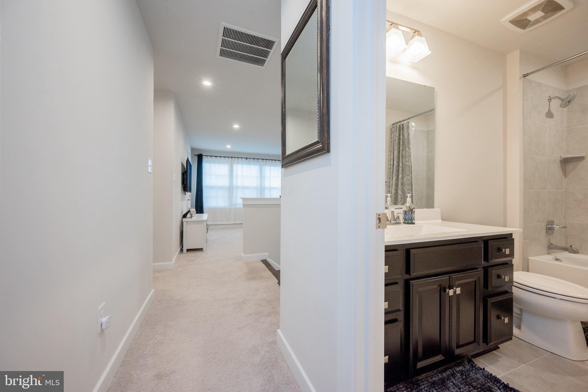 772 Wallasey Drive Middletown, DE 19709 - Photo 35 of 60 a bathroom with a sink a toilet and mirror