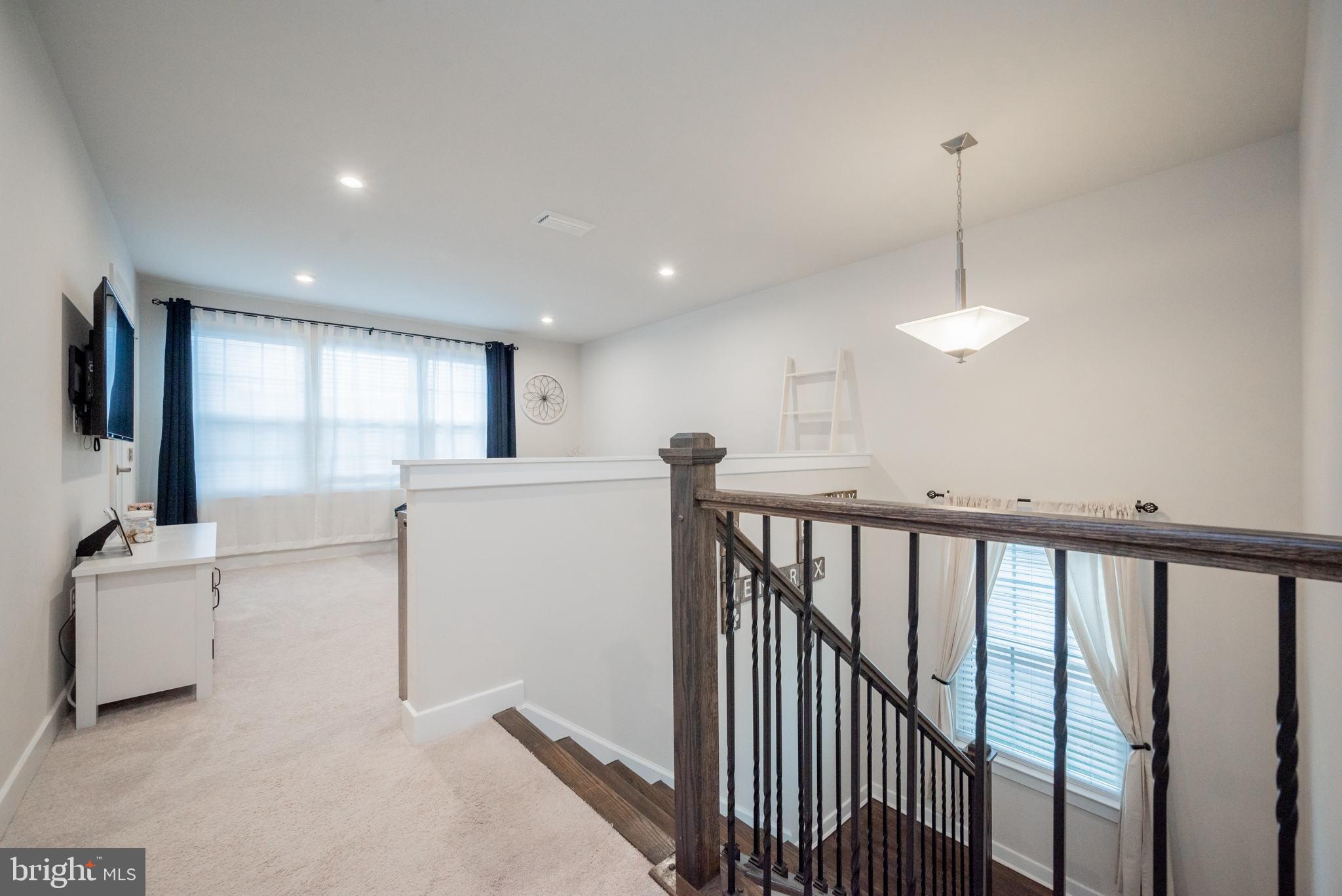 772 Wallasey Drive Middletown, DE 19709 - Photo 36 of 60 a view of a hallway with furniture and floor to ceiling window
