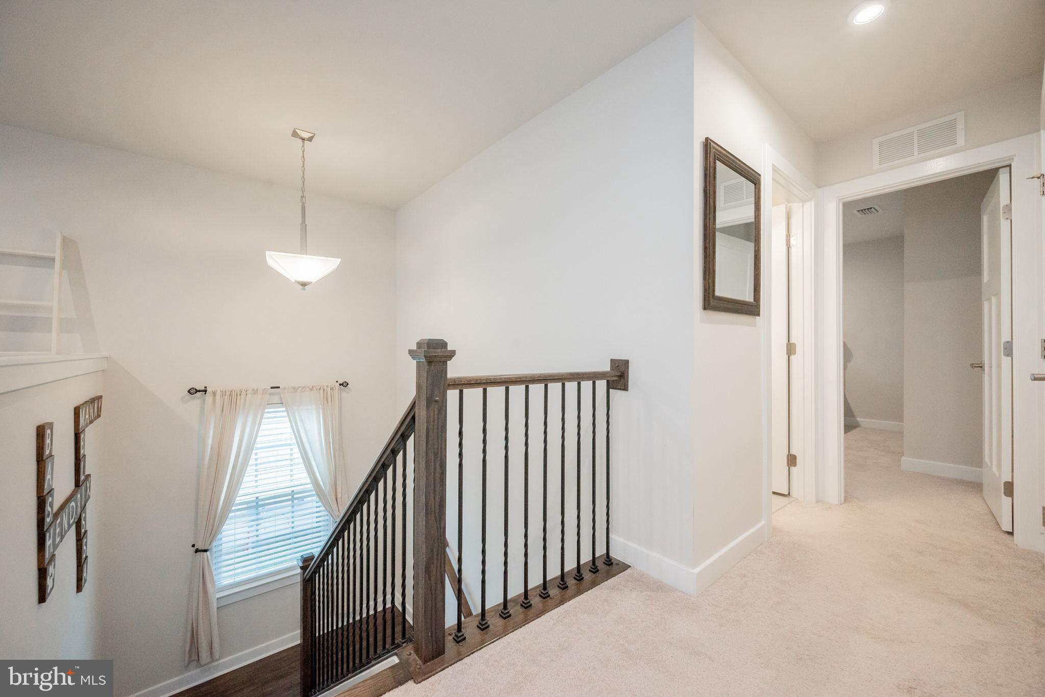 772 Wallasey Drive Middletown, DE 19709 - Photo 37 of 60 a view of a hallway with entryway and stairs
