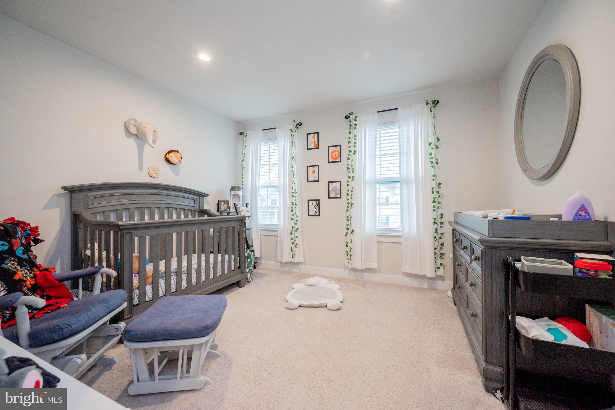 772 Wallasey Drive Middletown, DE 19709 - Photo 43 of 60 a bedroom with furniture and a chair